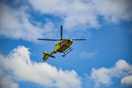 Persoon vast in papiercontainer in Baarn