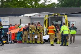 Persoon vast in papiercontainer in Baarn